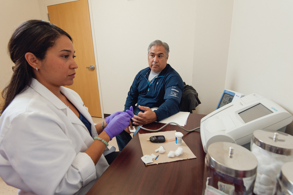 Public Health student helping a patient